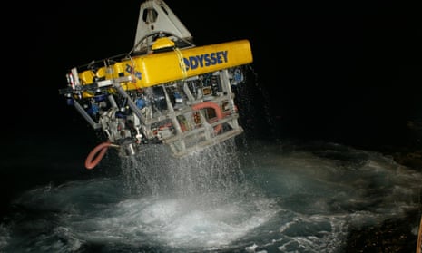 Odyssey's Zeus ROV being launched into the sea at night