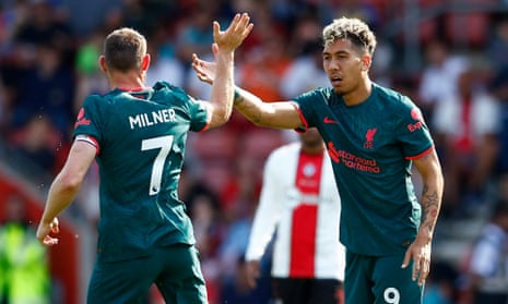 Roberto Firmino celebrates with James Milner after Liverpool’s second goal at Southampton