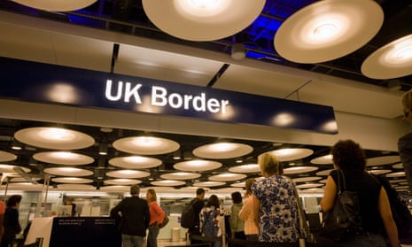 Passengers await their turn at the UK Border Agency’s passport control at Heathrow.