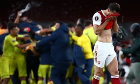 Arsenal’s Pablo Mari looks dejected as Villarreal celebrate after the match.