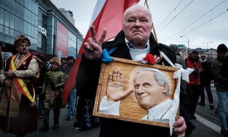 Thousands of people marching through Warsaw to commemorate Pope John Paul II