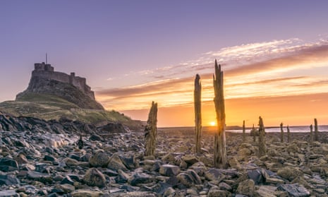 Scenic View Of Holy Island and Mountains Against Sky During