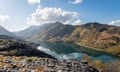 A view from a slate quarry of a lake and mountains