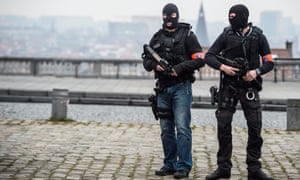 Police stand guard outside court where Salah Abdeslam, wanted over Paris attacks, was appearing