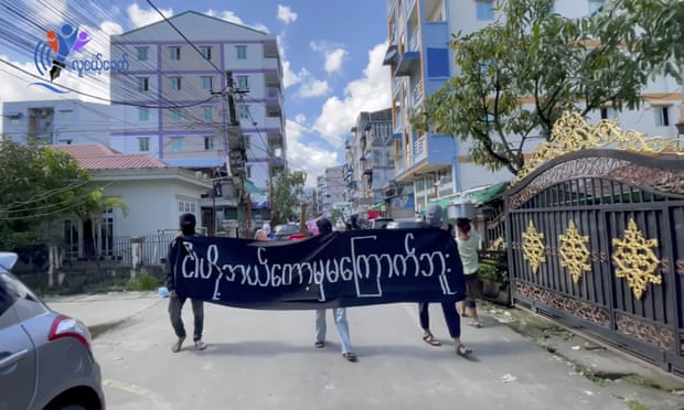 Masked protesters in Yangon.