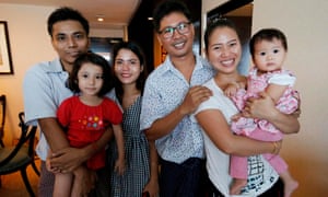 From left, Kyaw Soe Oo with his daughter and wife Chit Su Win. Wa Lone with wife Pan Ei Mon and their daughter.