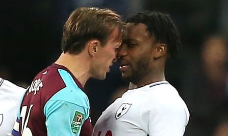 Mark Noble of West Ham United clashes with Danny Rose of Tottenham Hotspur.