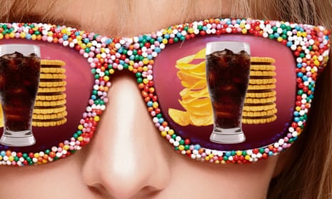 A woman's sunglasses reflect piles of crisps, cola, biscuits