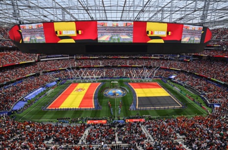 Spain and Belgium flags are displayed on the pitch as the players stand ready for the 2026 World Cup quarter-final.