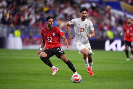 Omar Marmoush and Iran's Mohammad Ghorbani battle for the ball.