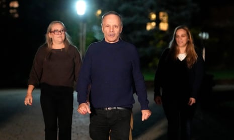 Uri Raanan, centre, outside his Illinois home with his wife Paola Raanan, left, and sister Sigal Zamir after the hostage releases
