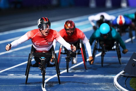 Nathan Maguire crosses the line to win gold