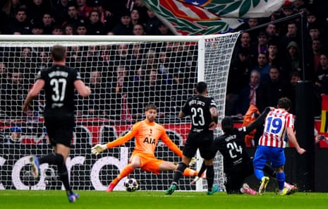 Julian Alvarez slots the ball past Tottenham Hotspur goalkeeper Guglielmo Vicario to score his second, and Atletico’s fifth goal of the game.
