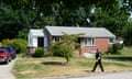 A police officer walks past a home believed to be connected to the shooter in the assassination attempt of Republican presidential candidate former President Donald Trump, Monday, July 15, 2024, in Bethel Park, Pa. Investigators are hunting for any clues about what may have driven Thomas Matthew Crooks to try to assassinate Trump. (AP Photo/Gene J. Puskar)