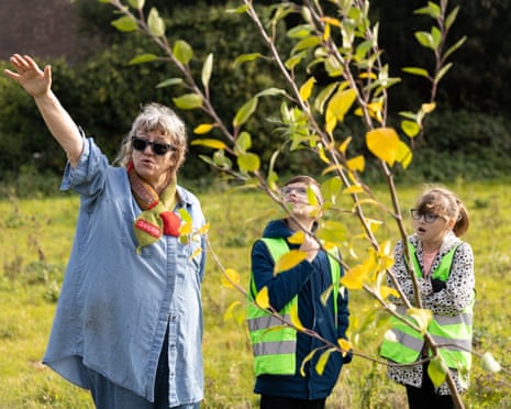 Part art, part educational workshop … Anya Gallaccio in her Kent orchard with her helpers.