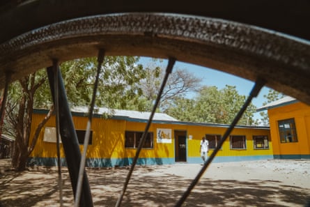 Exterior view of a yellow-walled compound.