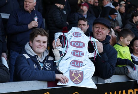 Two West Ham's brandish the obligatory tinfoil FA Cup at the Prielli Stadium.