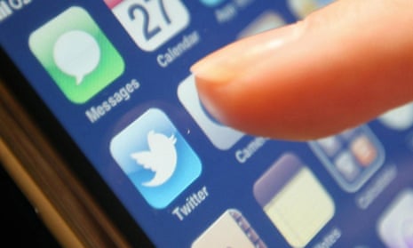 Smartphone showing finger about to click on Twitter app