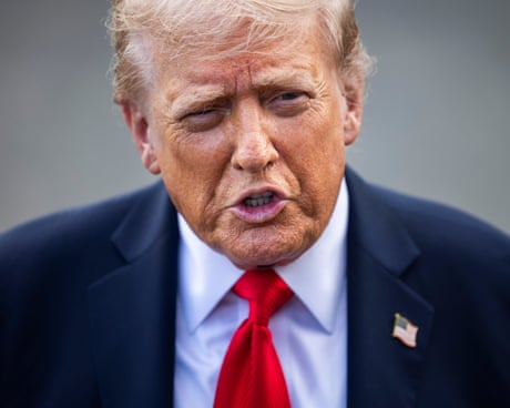 a man in a suit speaks