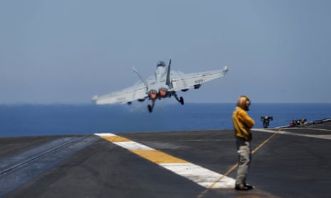 An F/A-18 fighter taking off from the USS Harry S Truman aircraft carrier in the eastern Mediterranean.