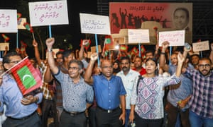 Opposition supporters in Malé protest the government’s delay in following the supreme court order on Sunday.