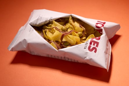 Torres black truffle crisps served with olives and anchovies.