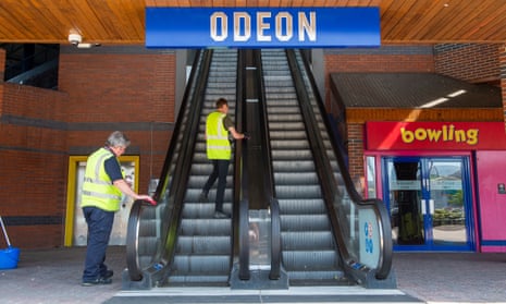 Cleaners on Odeon escalator