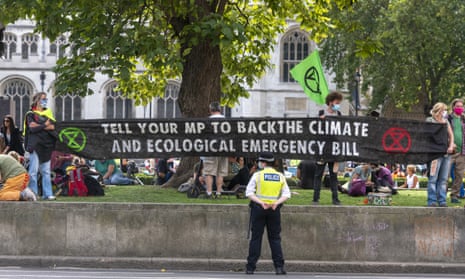 Extinction Rebellion protesters take part in a demonstration in Westminster in London