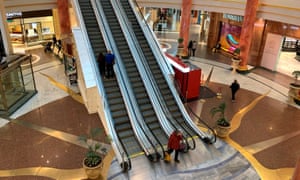Shoppers are seen inside a deserted Intu Trafford Centre amid the coronavirus outbreak in Manchester.