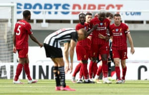 Liverpool’s Divock Origi celebrates with team-mates after scoring his side’s second goal.
