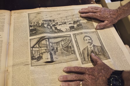 Rogers’ hands above an article about the Titanic