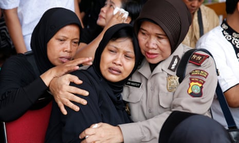 The mother of Indonesian policeman Gilang Adinata, who was killed in a suicide bomb blast weeps during a funeral ceremony in Jakarta, Indonesia.