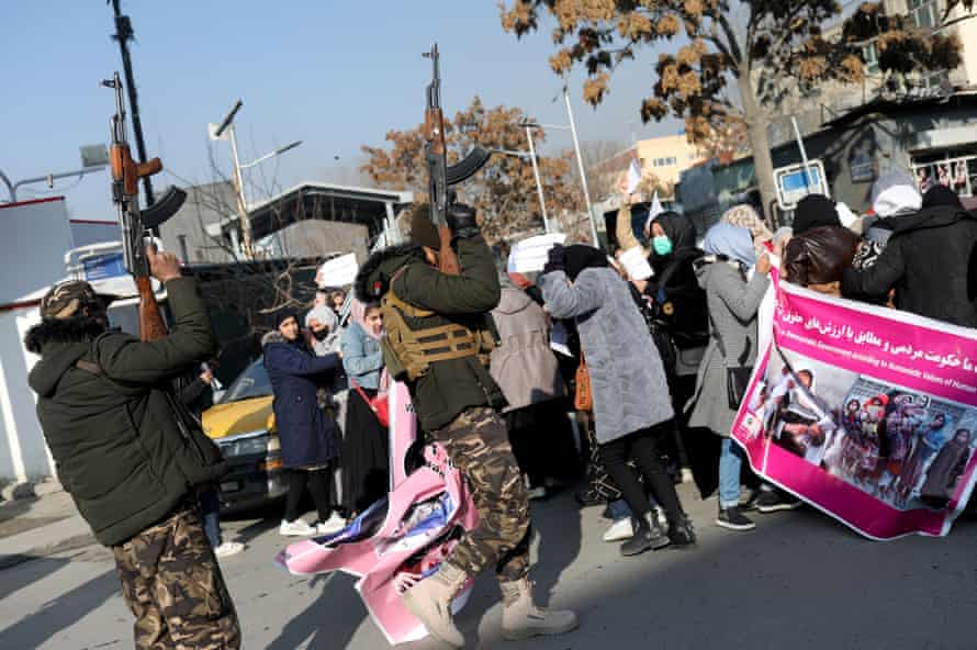 Taliban forces fire in the air to disperse Afghan women protesting against Taliban restrictions, Kabul, 28 December 2021