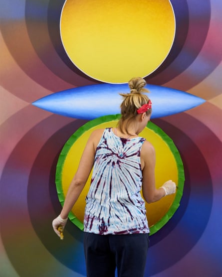 Hollowell painting a work from the Overview Effect series.