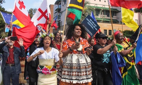 Members of 350 Pacific march at the global climate march in Sydney in September 2019.