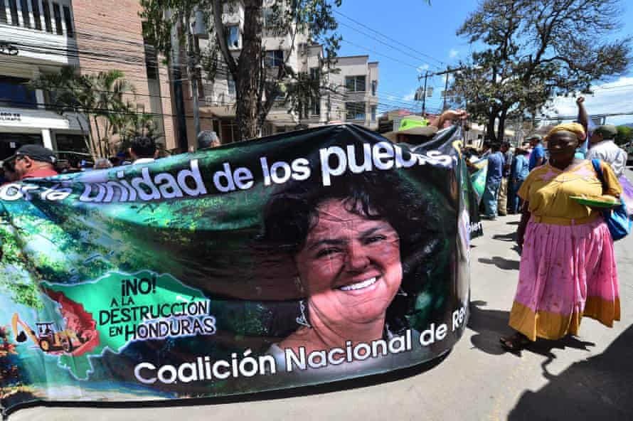People demonstrate for the liberation of 13 convicted environmentalists with a banner depicting Honduran murdered environmental leader Berta Caceres as they arrive for a hearing in Tegucigalpa.