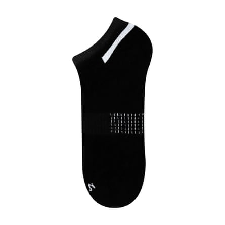 A black Naked Nation bamboo trainer sock with white detail.