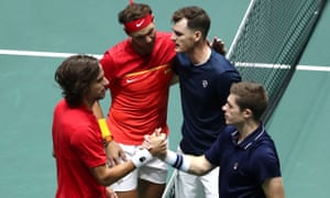 Spain’s Feliciano Lopez and Rafael Nadal shake hands with Britian’s Jamie Murray and Neal Skupski after their doubles match.
