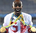 Gold medallist Britain’s Mo Farah celebrates near the podium for the Men’s 5000m during the athletics event at the Rio 2016 Olympic Games 2016.