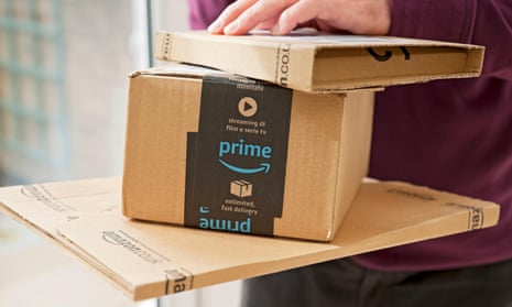 Man holding Amazon packages in the  UK