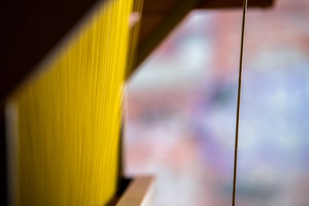 A closeup of thread in the loom