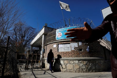 An Afghan student walks past Kabul University in Kabul, Afghanistan