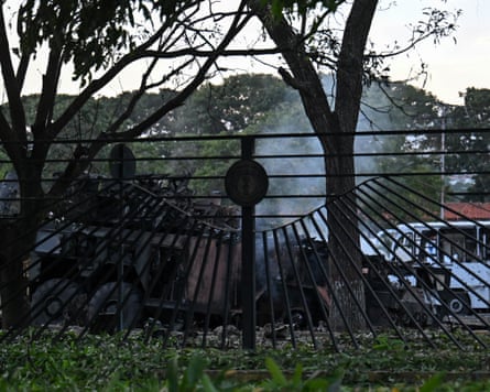 A burnt-out vehicle is seen at La Carlota airbase in Caracas