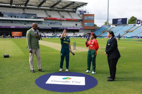The captains take part in the coin toss.