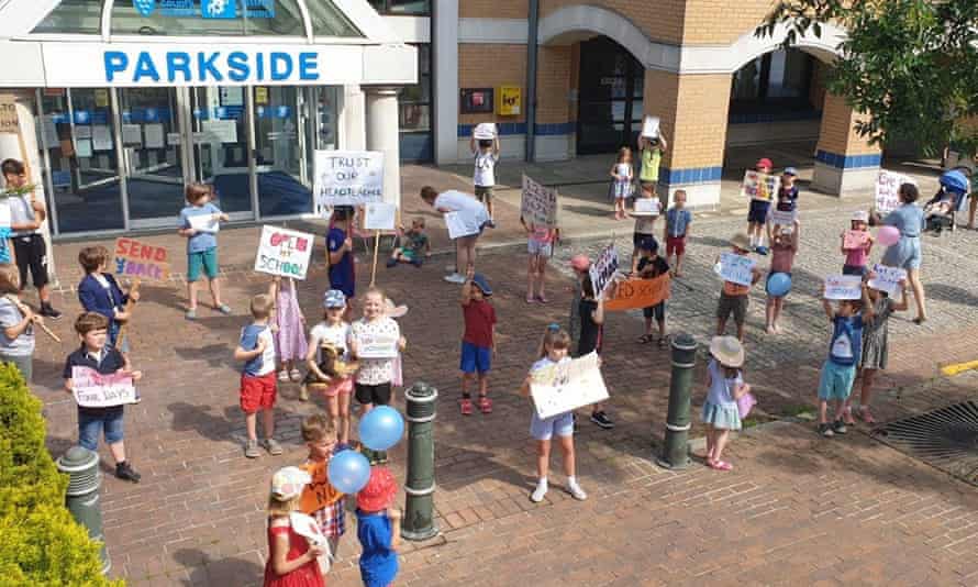 Parents and children stage a protest outside a West Sussex County Council building after plans to get children back to school were rejected.