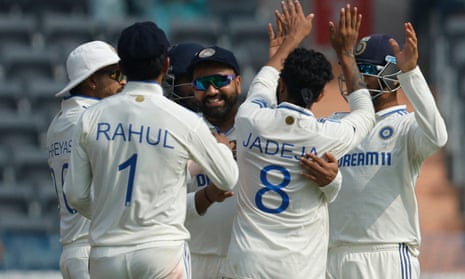 Rohit Sharma (centre) celebrates catching England’s Ollie Pope on day one of the first Test.
