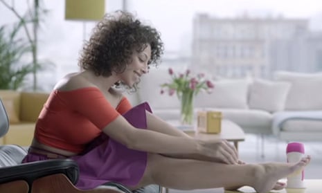 An advert showing a woman just hanging out, shaving her legs on her coffee table.
