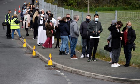 People line up outside a mobile vaccination centre yesterday in Bolton.