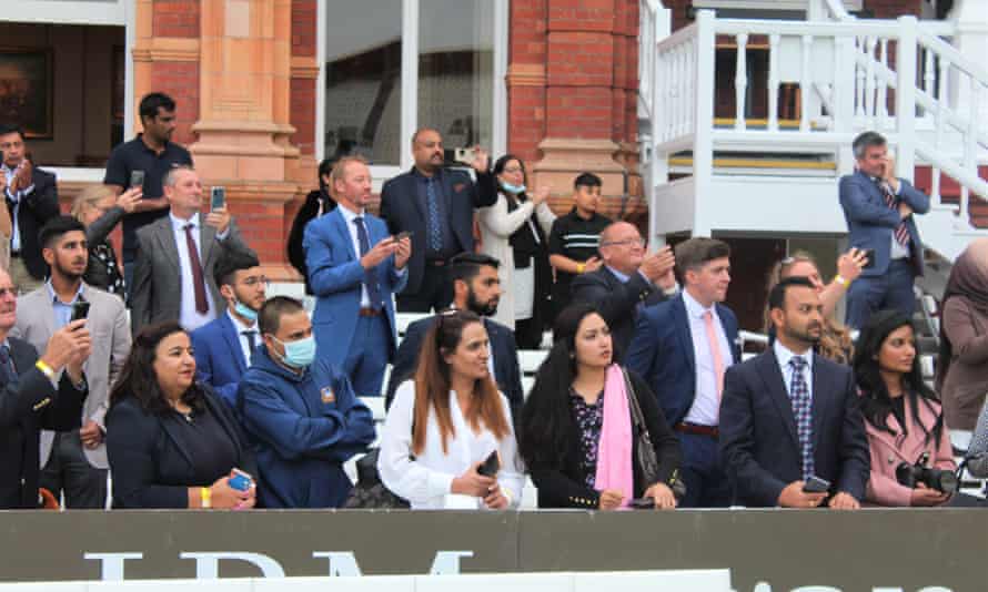 Players’ parents watch from the pavilion.