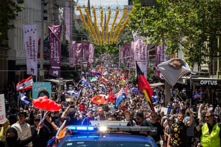 Protesters move down Bourke Street in Melbourne, Australia, to protest against mandatory vaccination.